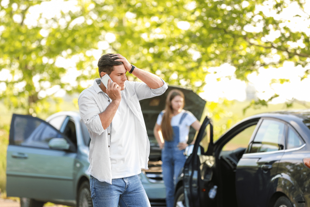 A man making a call at the accident scene