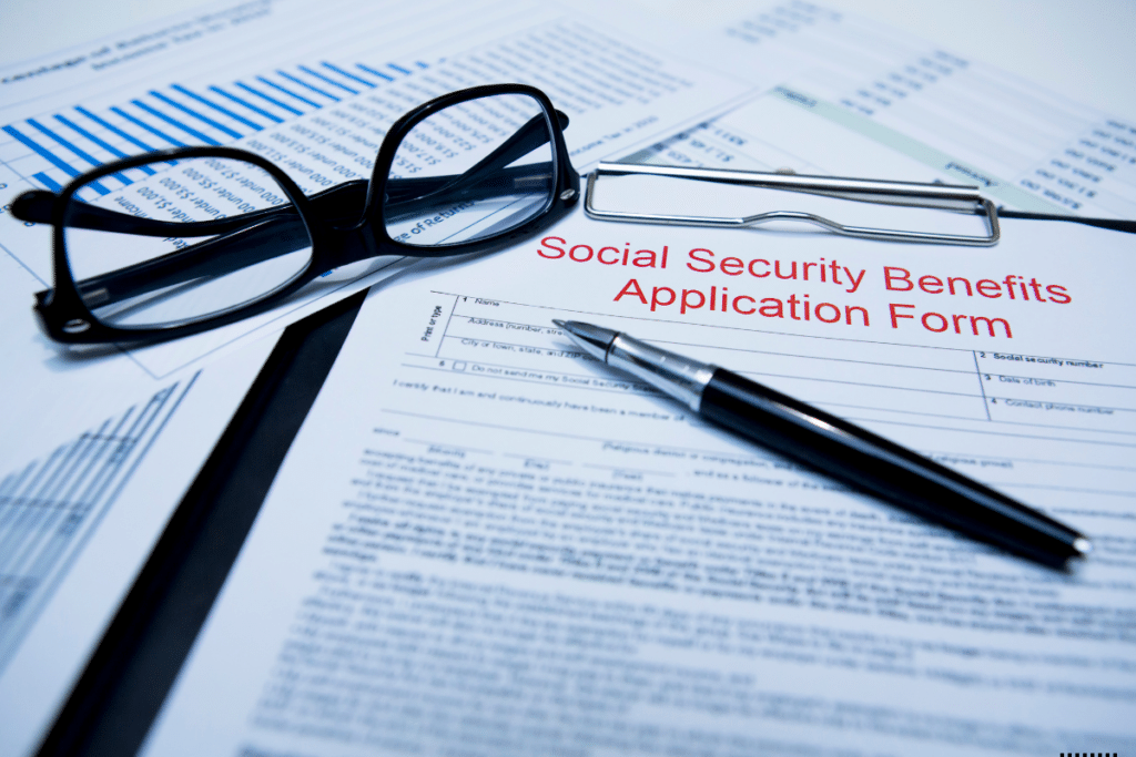 A glasses, pen and social security benefits form on the table