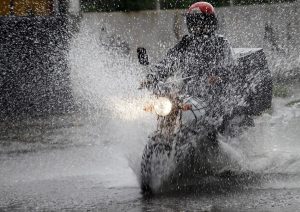 motorcycle driving in the rain