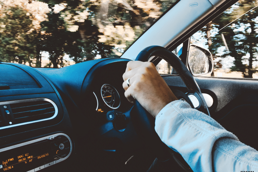 A man driving a car