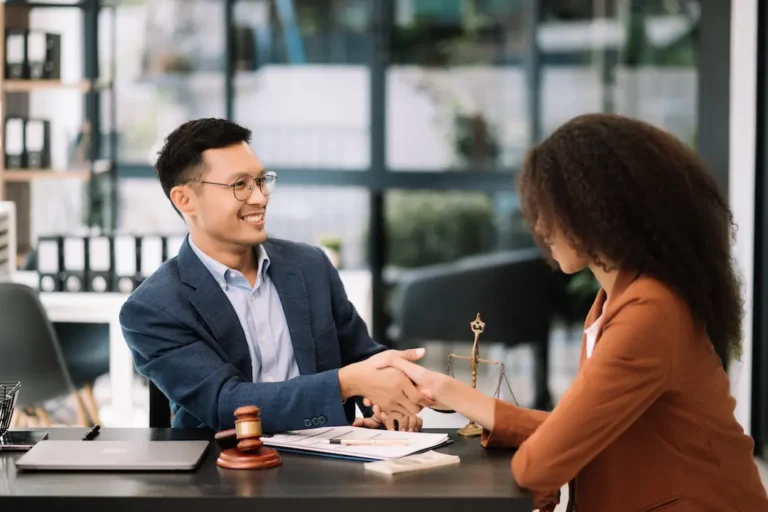 business-team-and-lawyers-discussing-contract-paper